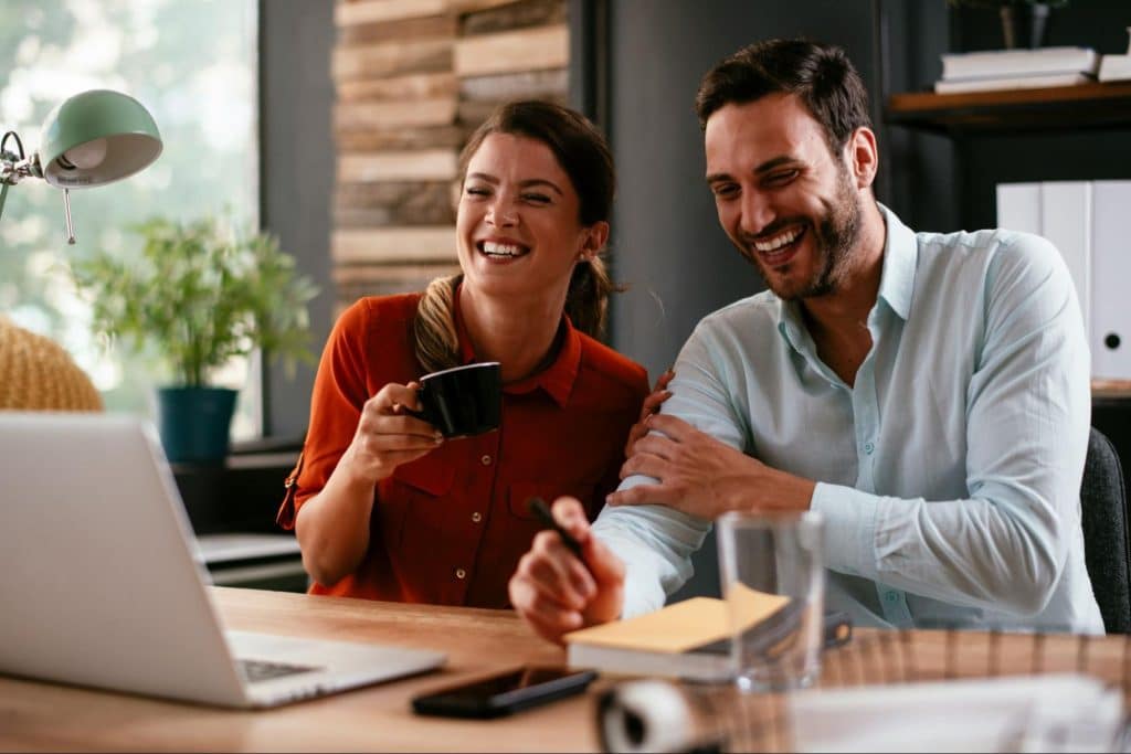 A man and woman laughing