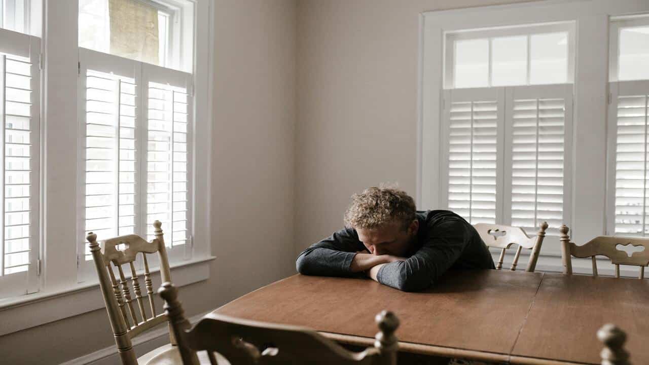 A man leaning on the table