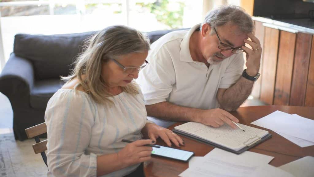 A mature couple working on their bills