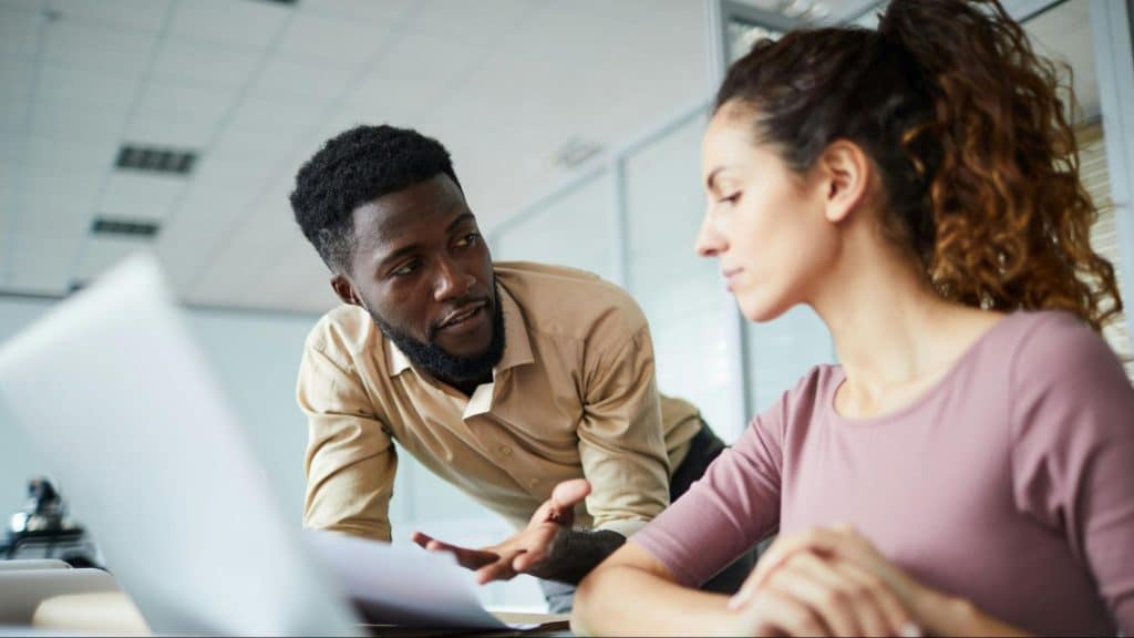 A man telling something to woman
