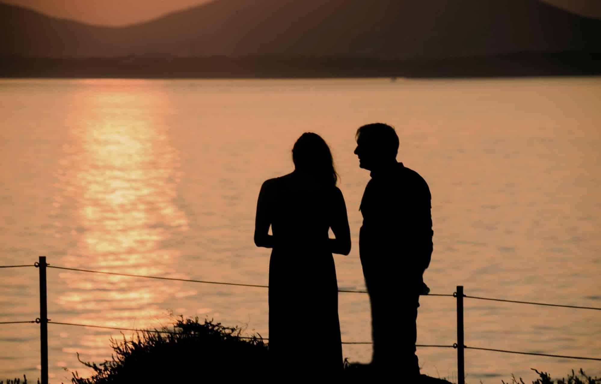 A man and woman watching the sunset