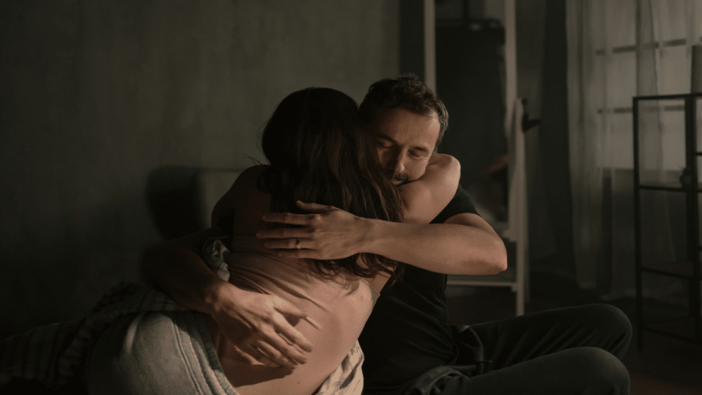 A couple giving each other a hug