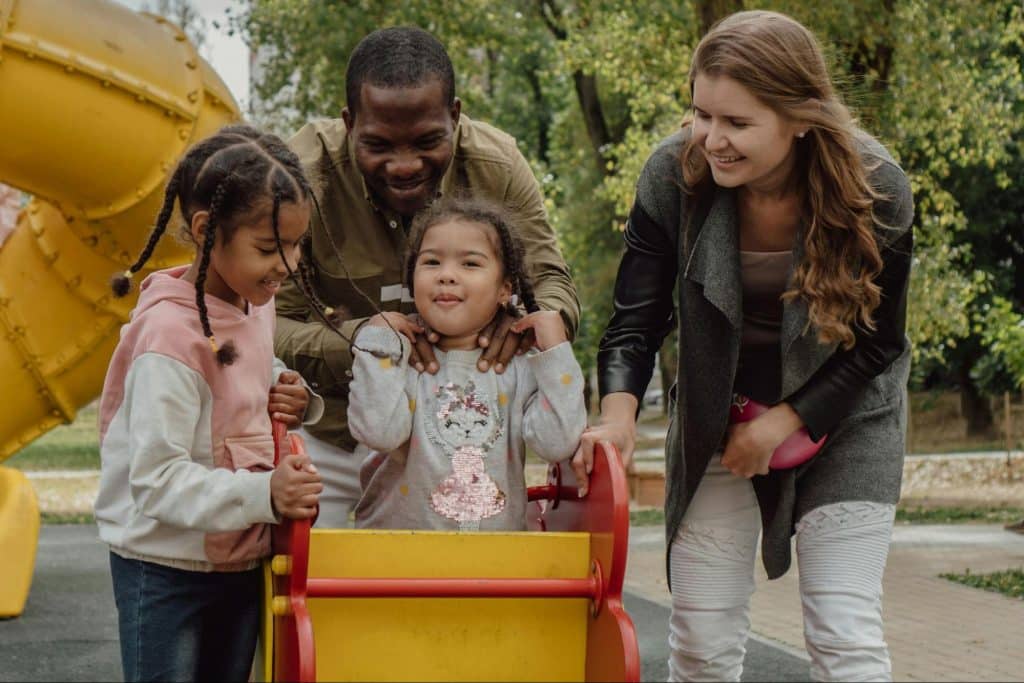 A man and woman with their children