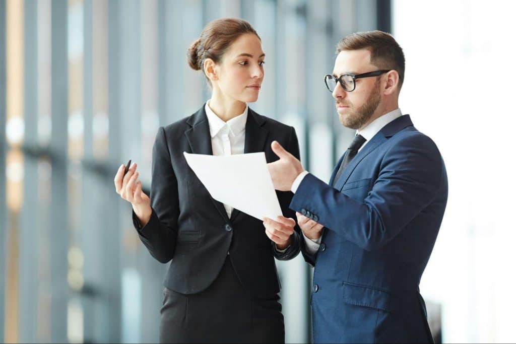 A man and woman talking about their finance