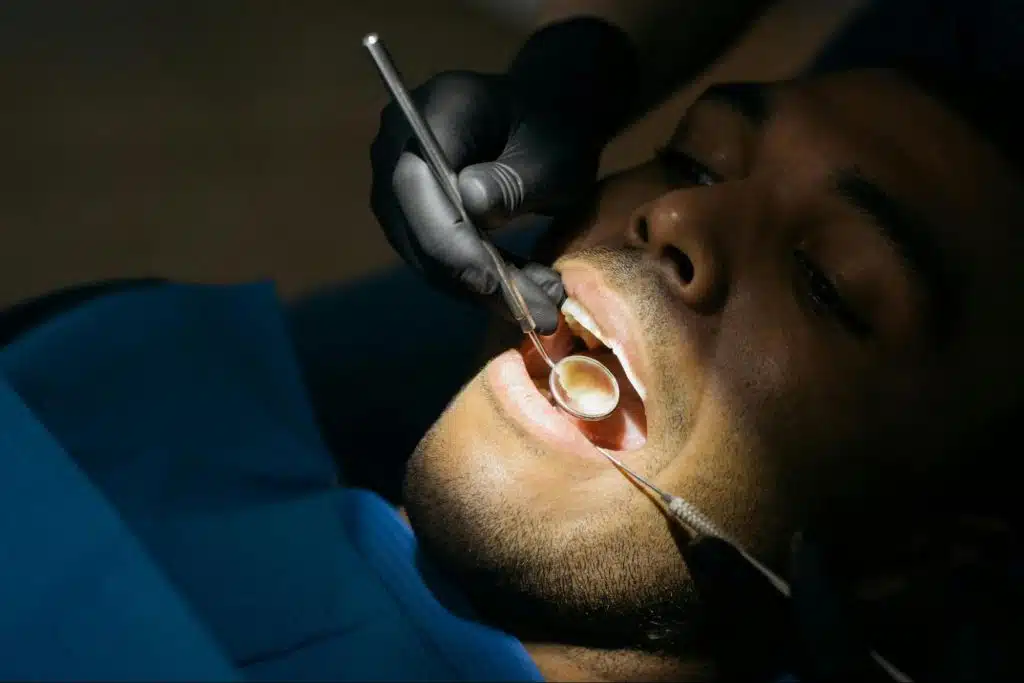 A man getting his teeth check