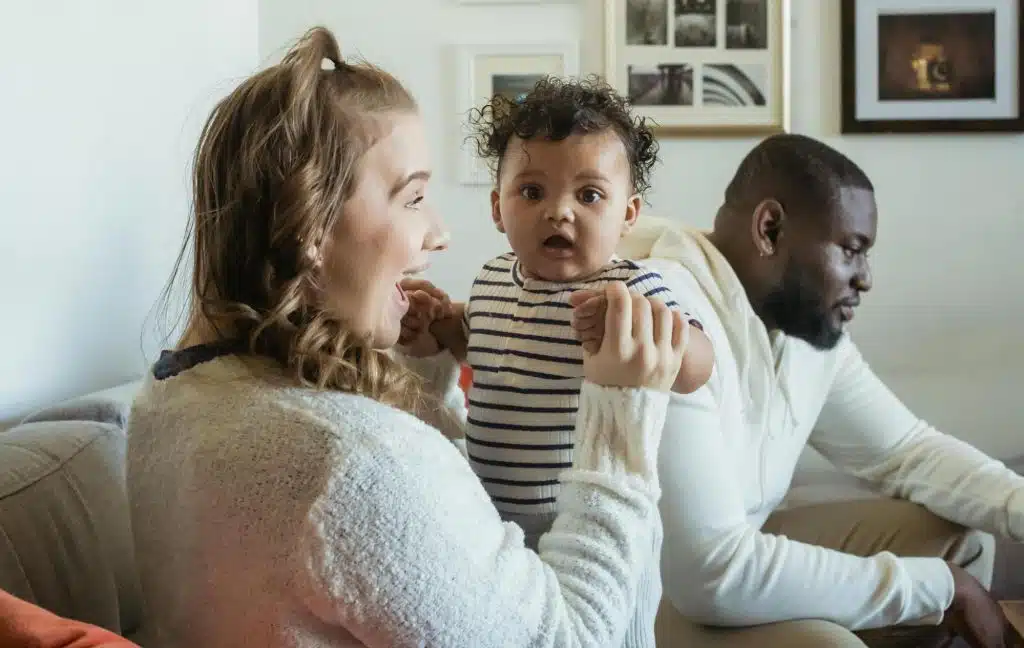 A man ignoring his woman and baby