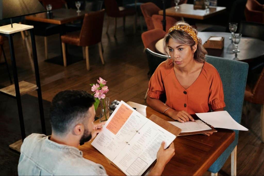 A woman looking bored with a man 
