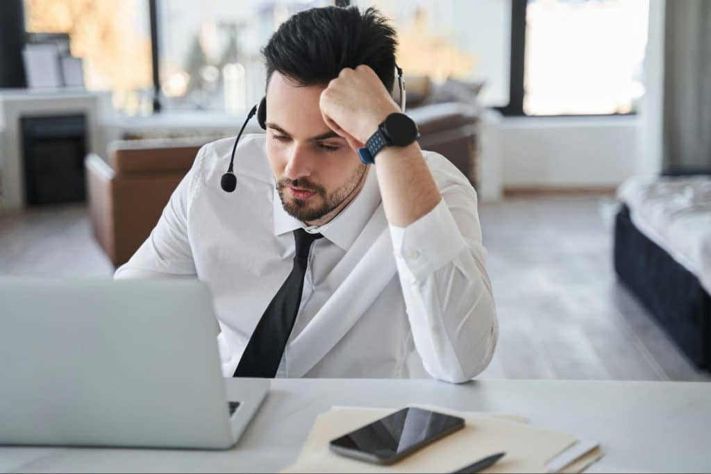 A man feeling tired at work