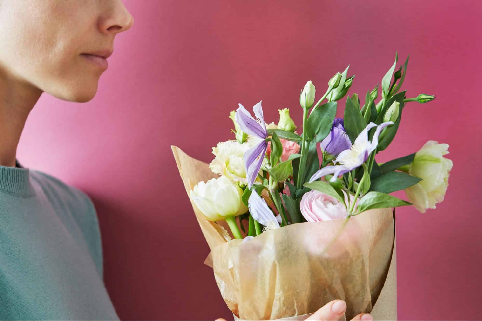 A woman holding a flowers