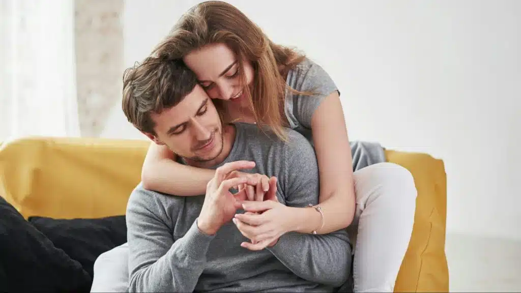 A woman hugging a man