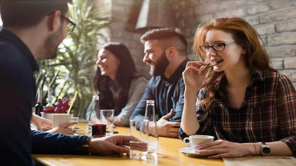 Colleagues having lunch at a restaurant 