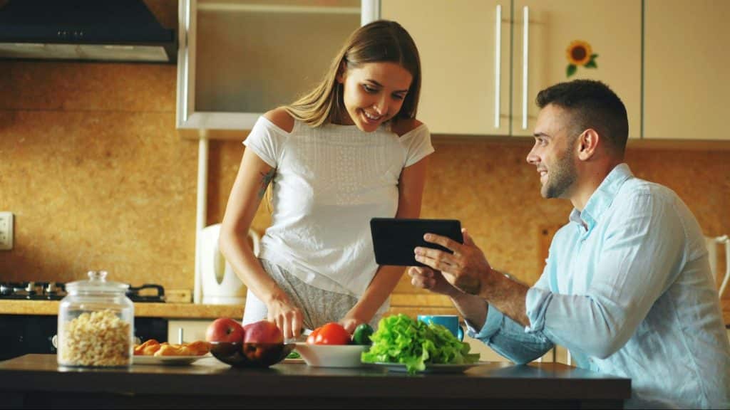 A man showing something to woman