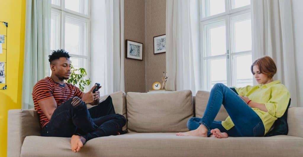 A couple busy with their mobile phones