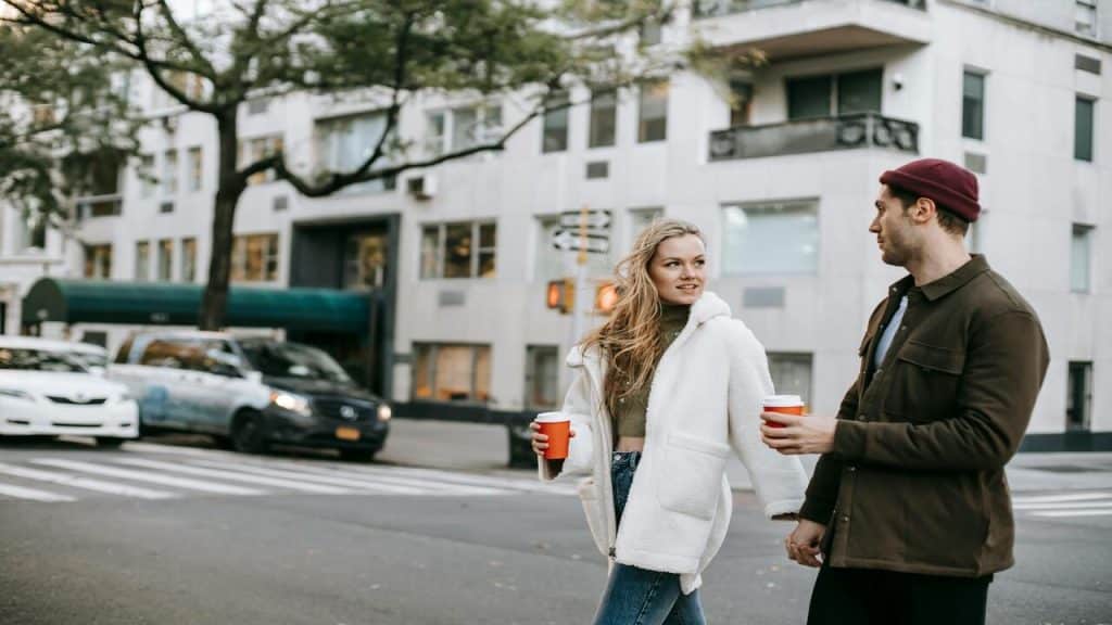 A couple talking on the side walk