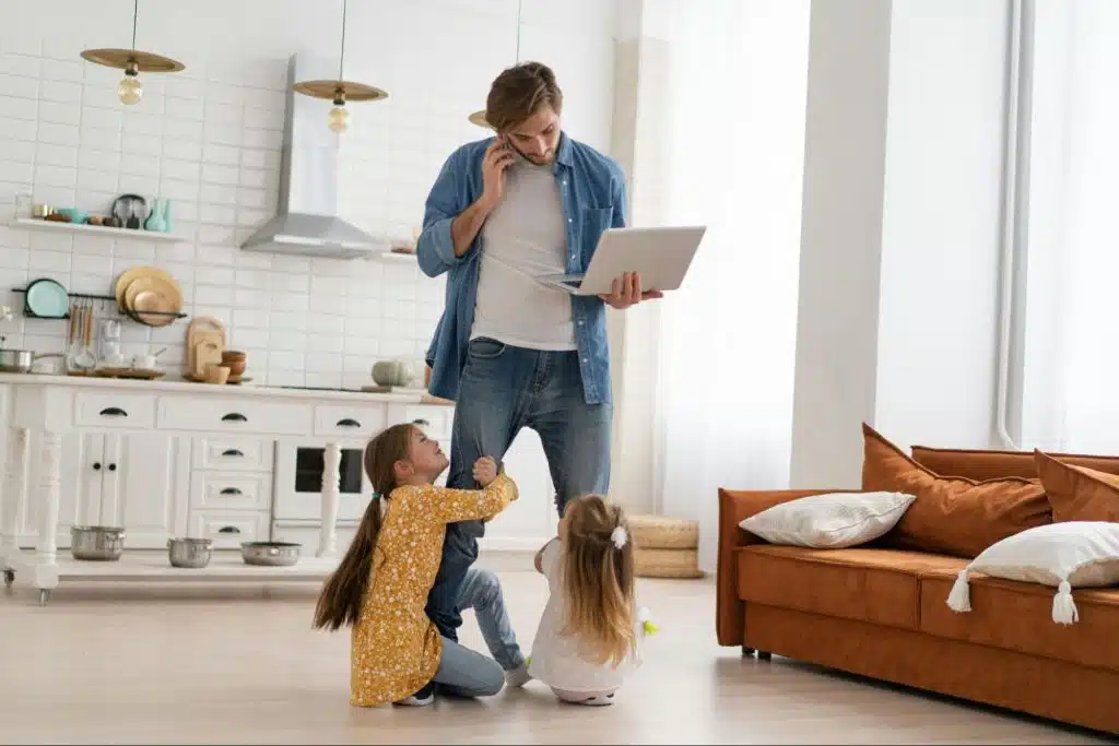 A man working while with his kids