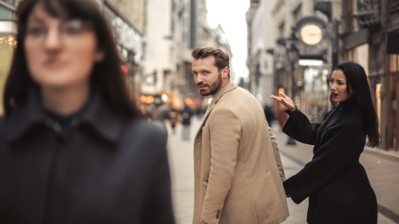 A woman annoyed at her husband looking at someone else
