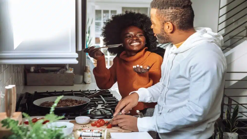 A couple cooking in the kitchen