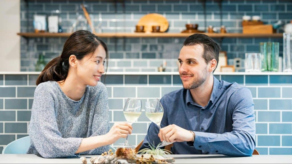 A man and woman smiling at each other