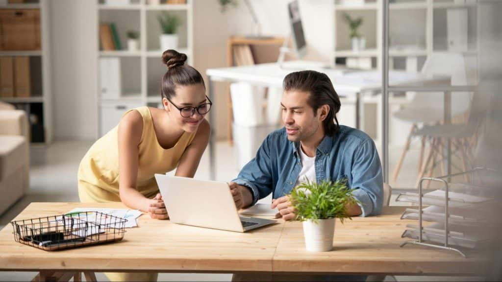 A man and woman talking about their work