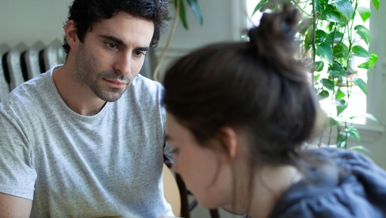 A man staring at the woman