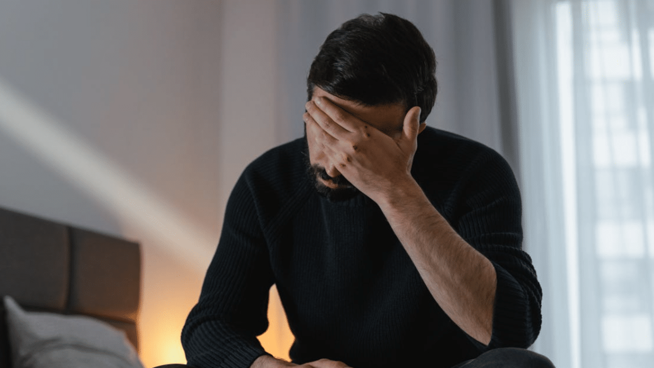 A man looking sad at home