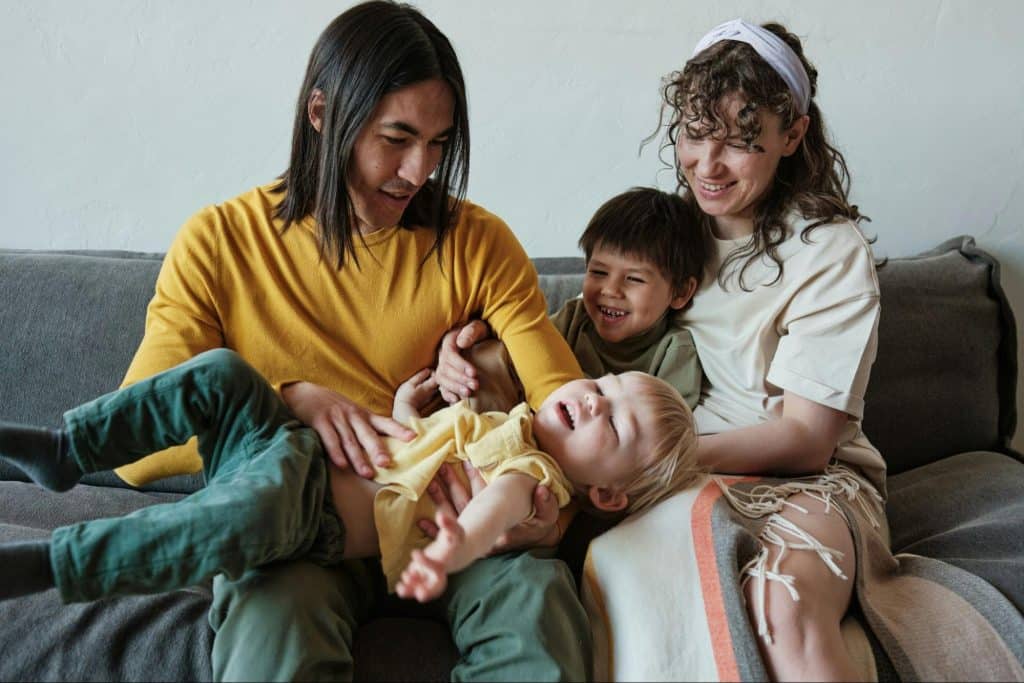 A man and woman with their children
