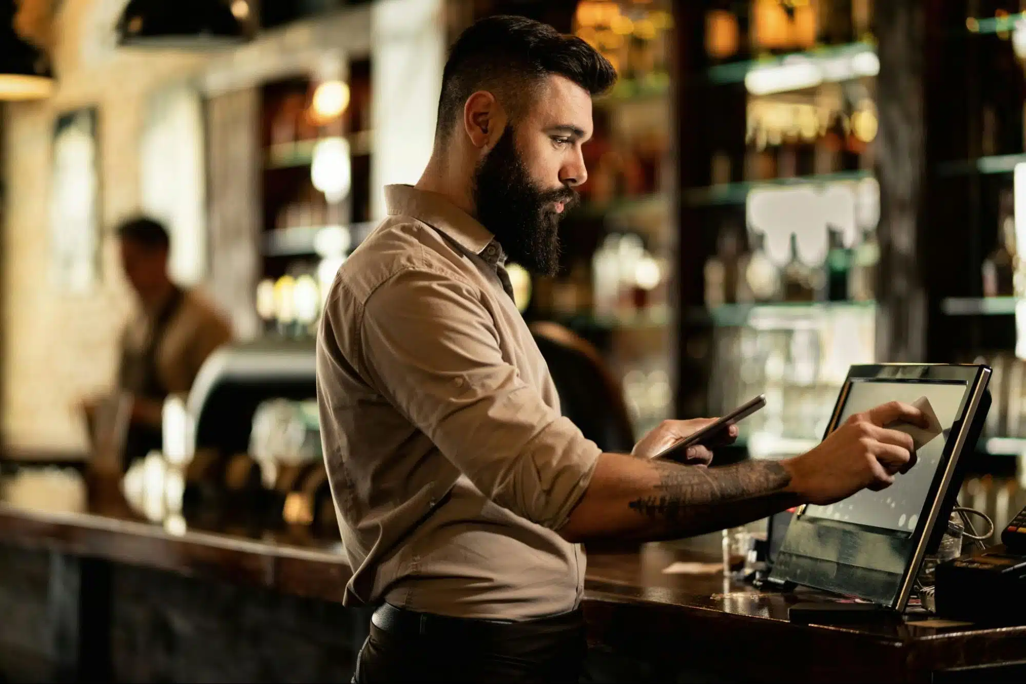 A man swiping his credit card