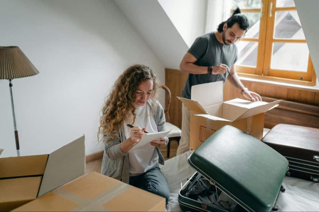 A man and woman doing house chores