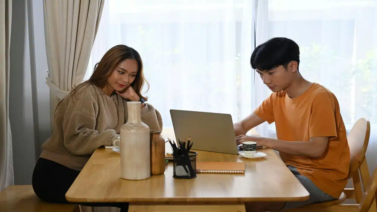 A couple busy at home