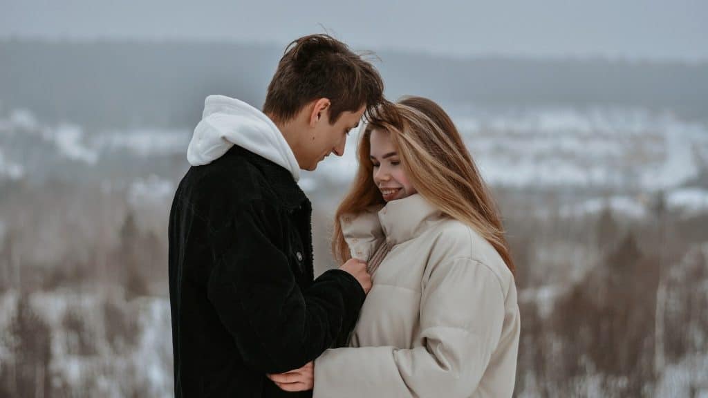 A couple spending time outdoors during winter.