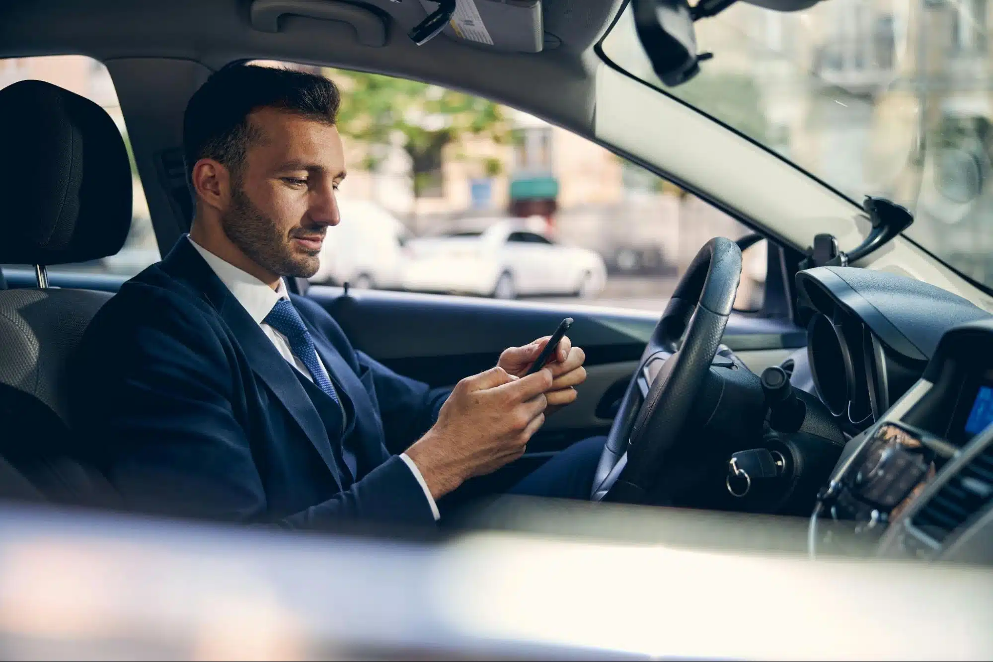 A man texting someone while driving