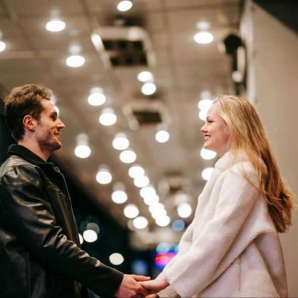A man and woman holding hands