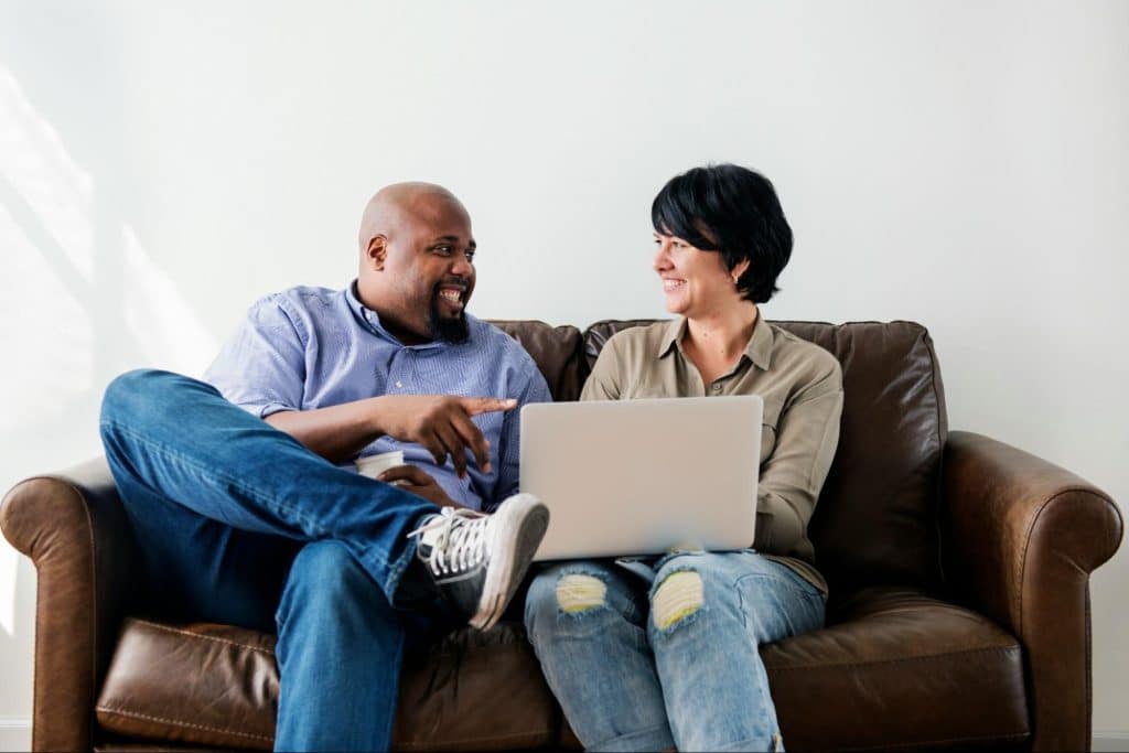 A man and woman smiling at each other