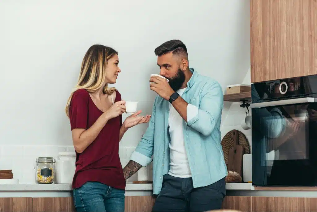 A man and woman at the kitchen