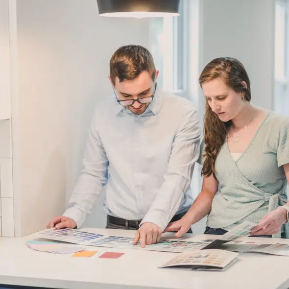 A couple browsing a pain brochure