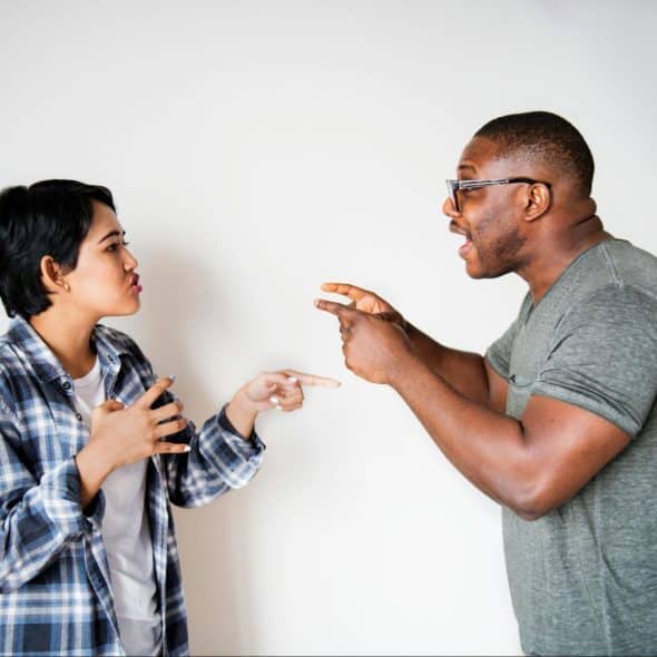 A man and woman shouting at each other