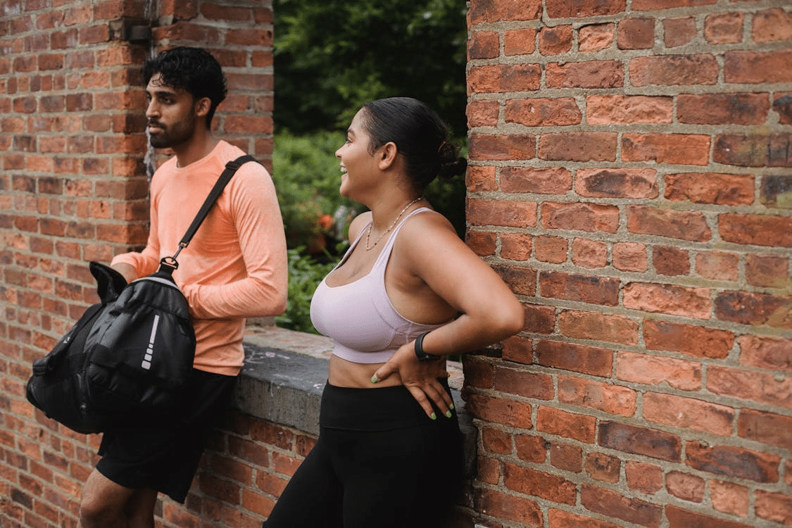 A man and a woman standing outside