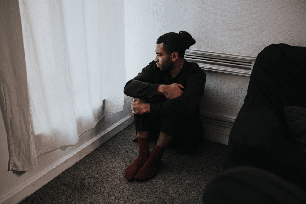 A man sitting on the floor