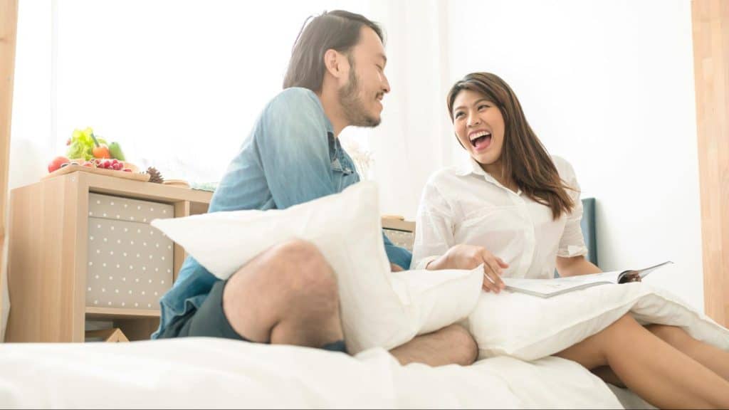 A woman being playful with the man