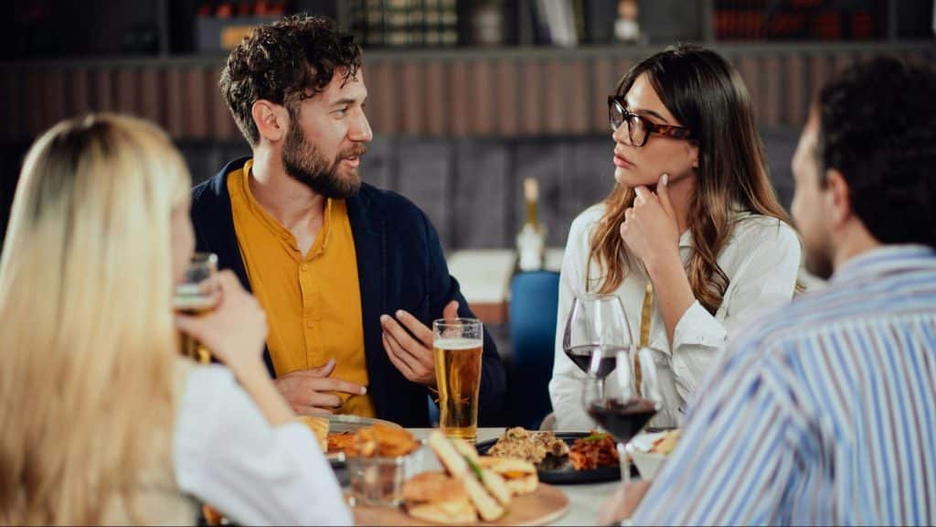 A woman listening to a man