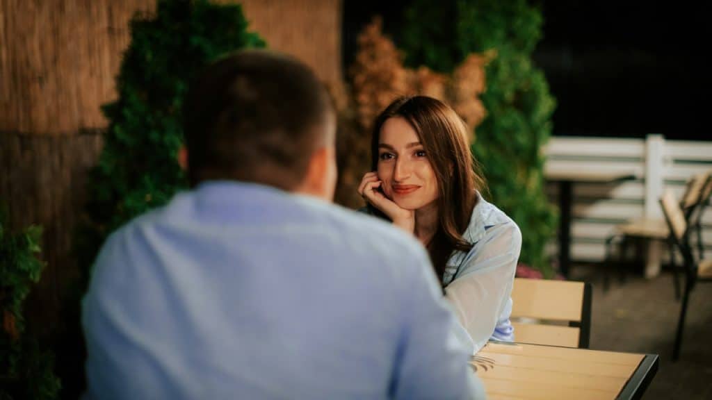 A man and a woman sitting at a table.