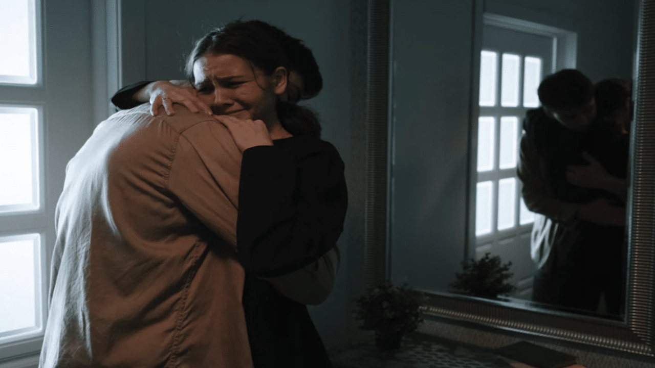 A man comforting his crying girlfriend