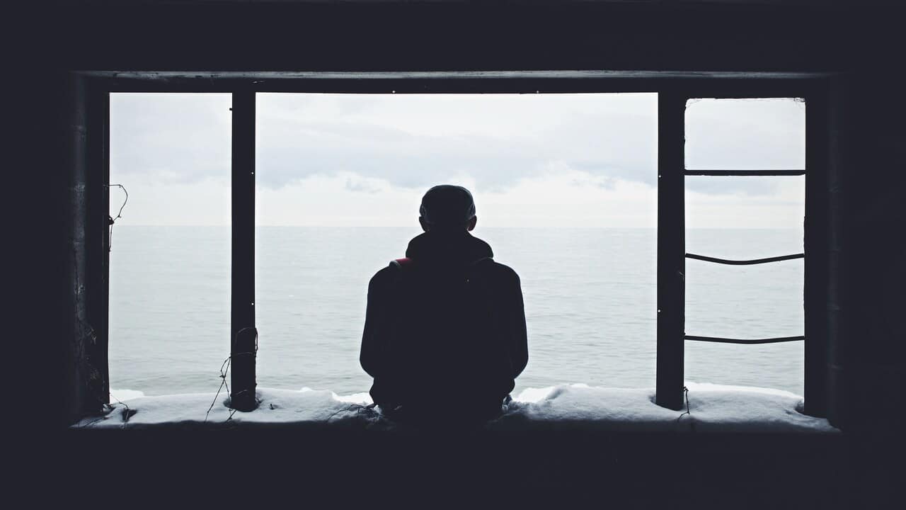 A man looking out the window