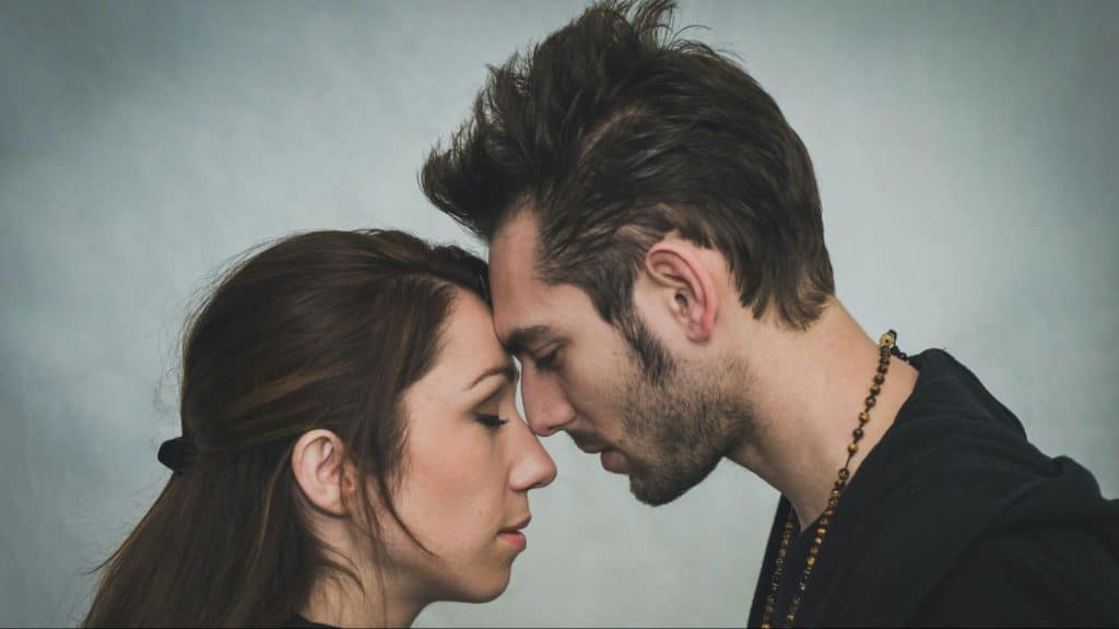 A man and woman ignoring stress