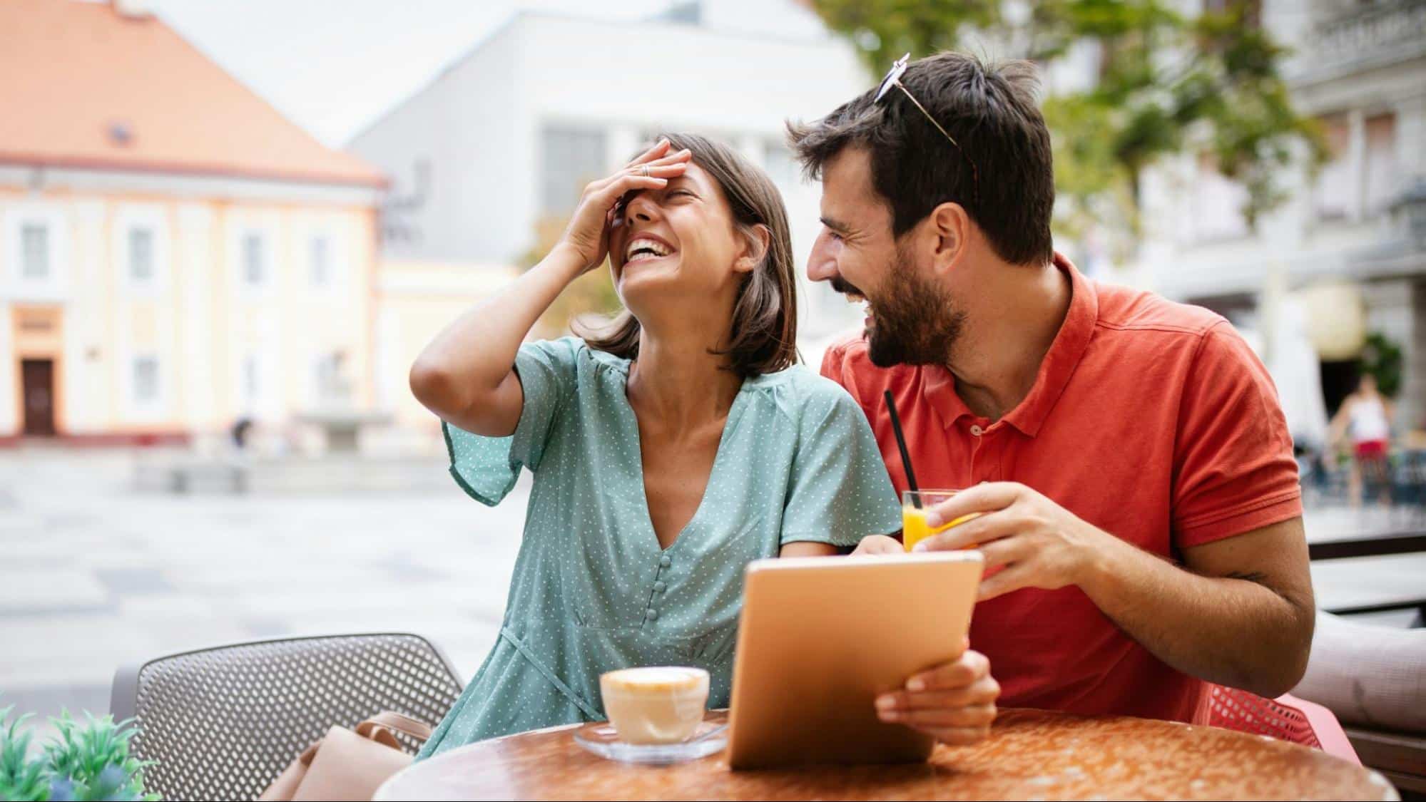 A man and woman laughing