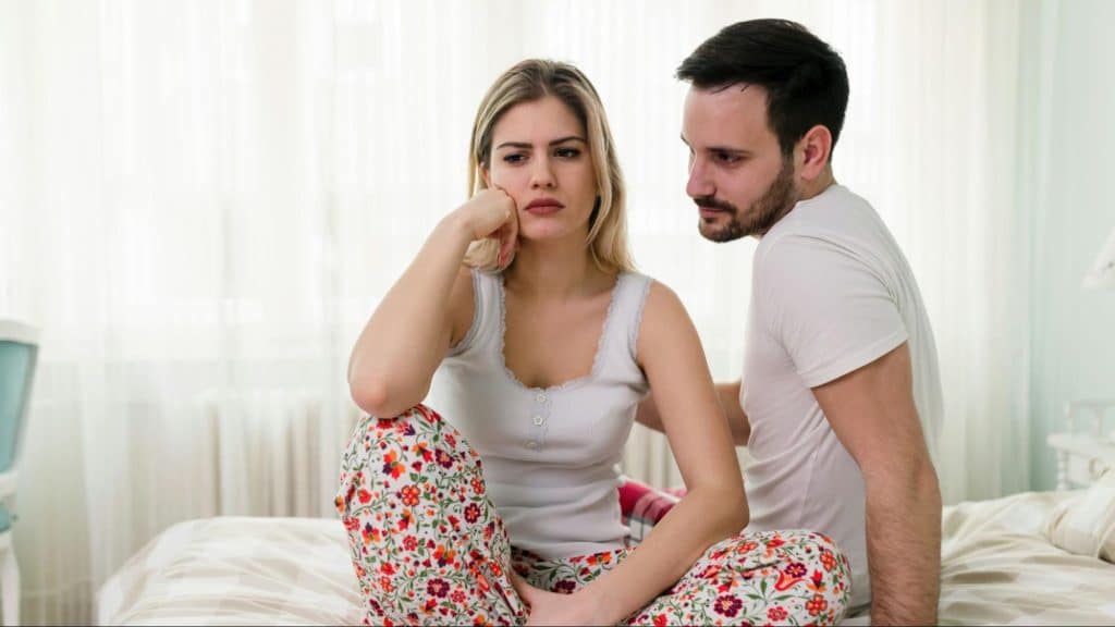 A man trying to speak with woman