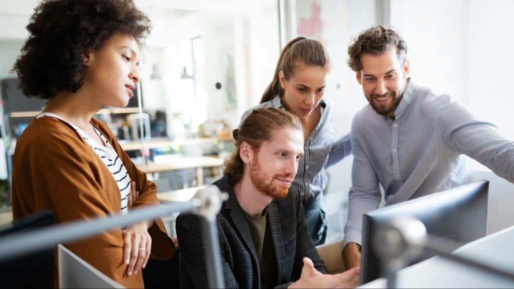 Colleagues commenting to man’s relationship