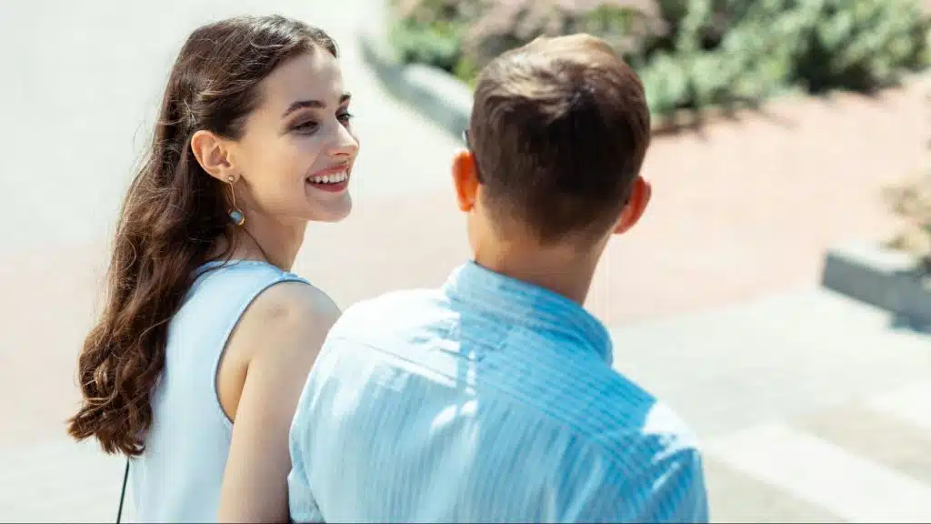 Woman saying something to a man