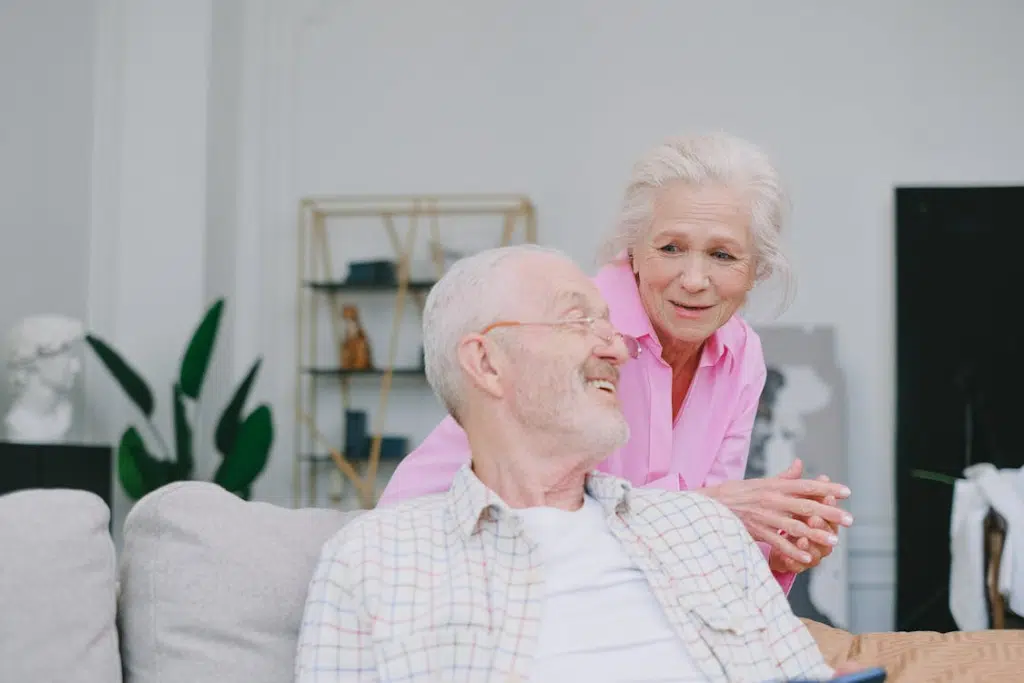 Happy mature couple in living room