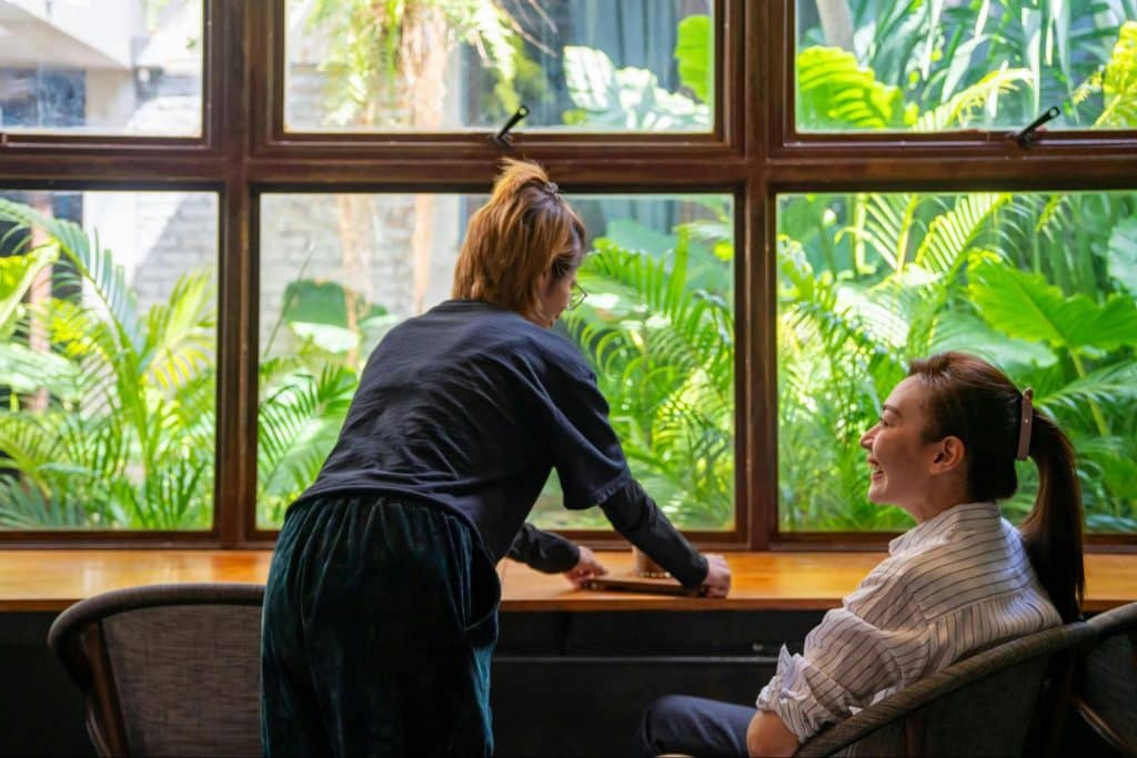 A wife serving coffee for mother-in-law
